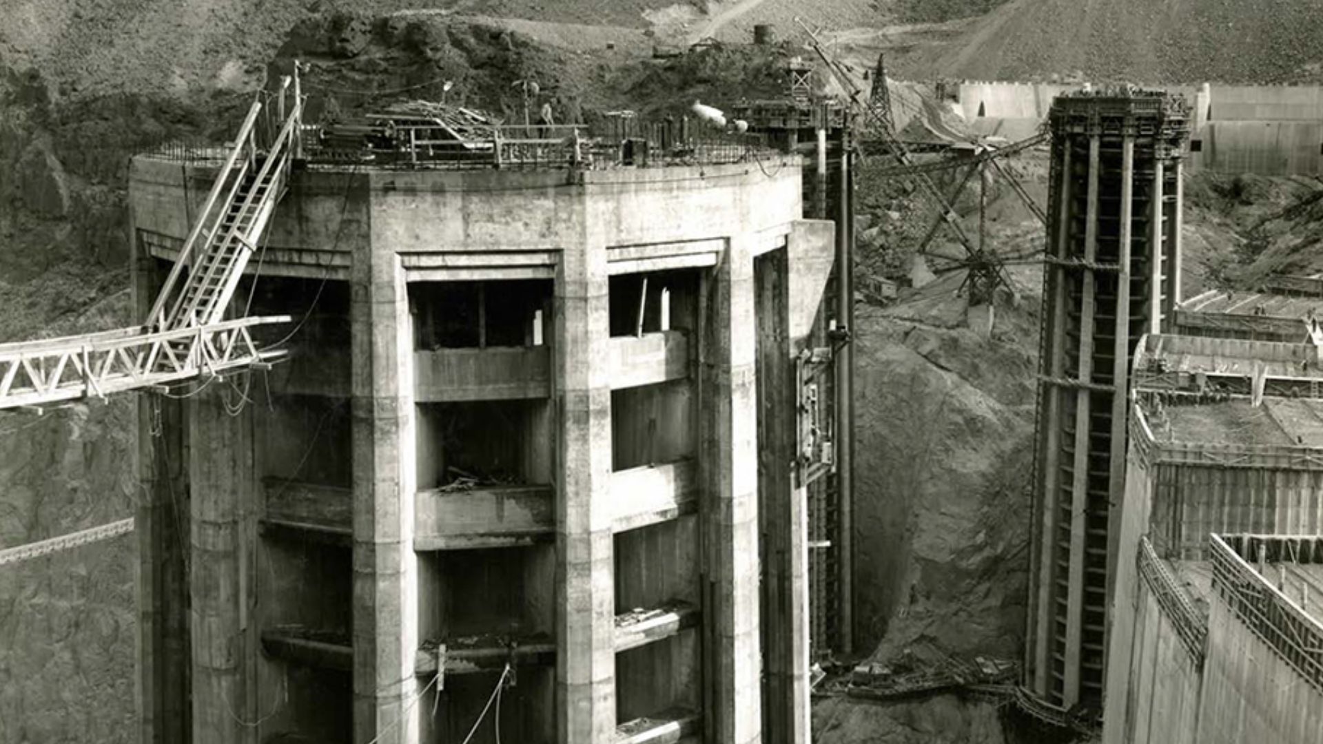 No. 5 Intake Tower finished to elevation 1232, showing curtain wall and, derrick on Arizona side, 12/05/1934 (31-al21-181)