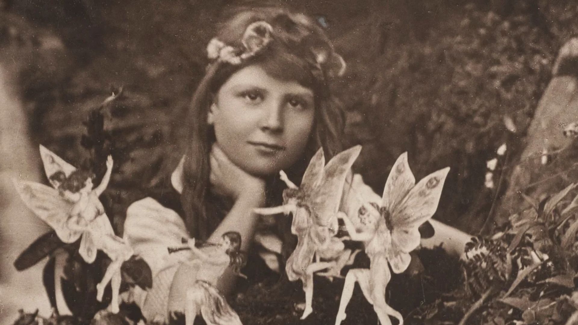 The first of the five photographs, taken by Elsie Wright in 1917, shows Frances Griffiths with the alleged fairies.