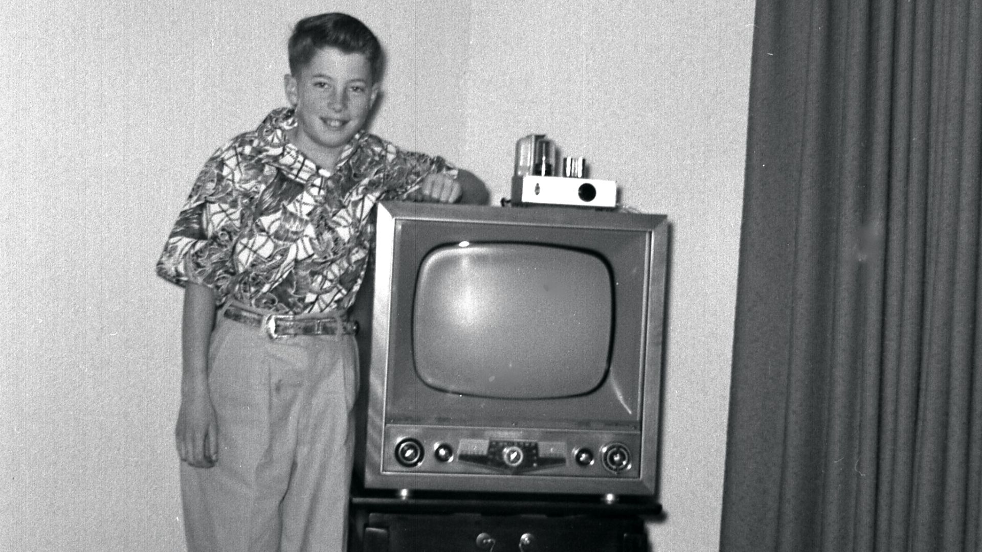 We got the set in late 1952 or early 1953;  the photo is probably from the same time and was taken in Eugene, Oregon (USA).  Until a local station started broadcasting, we only got a very fuzzy picture from a UHF station in Portland. The cable going off t