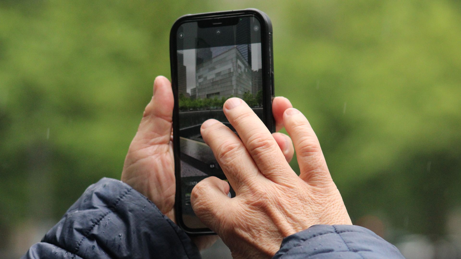 A man using a cell phone to take a photo
