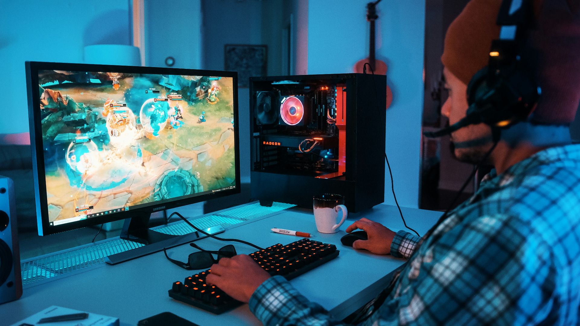 a person wearing headphones and using a computer