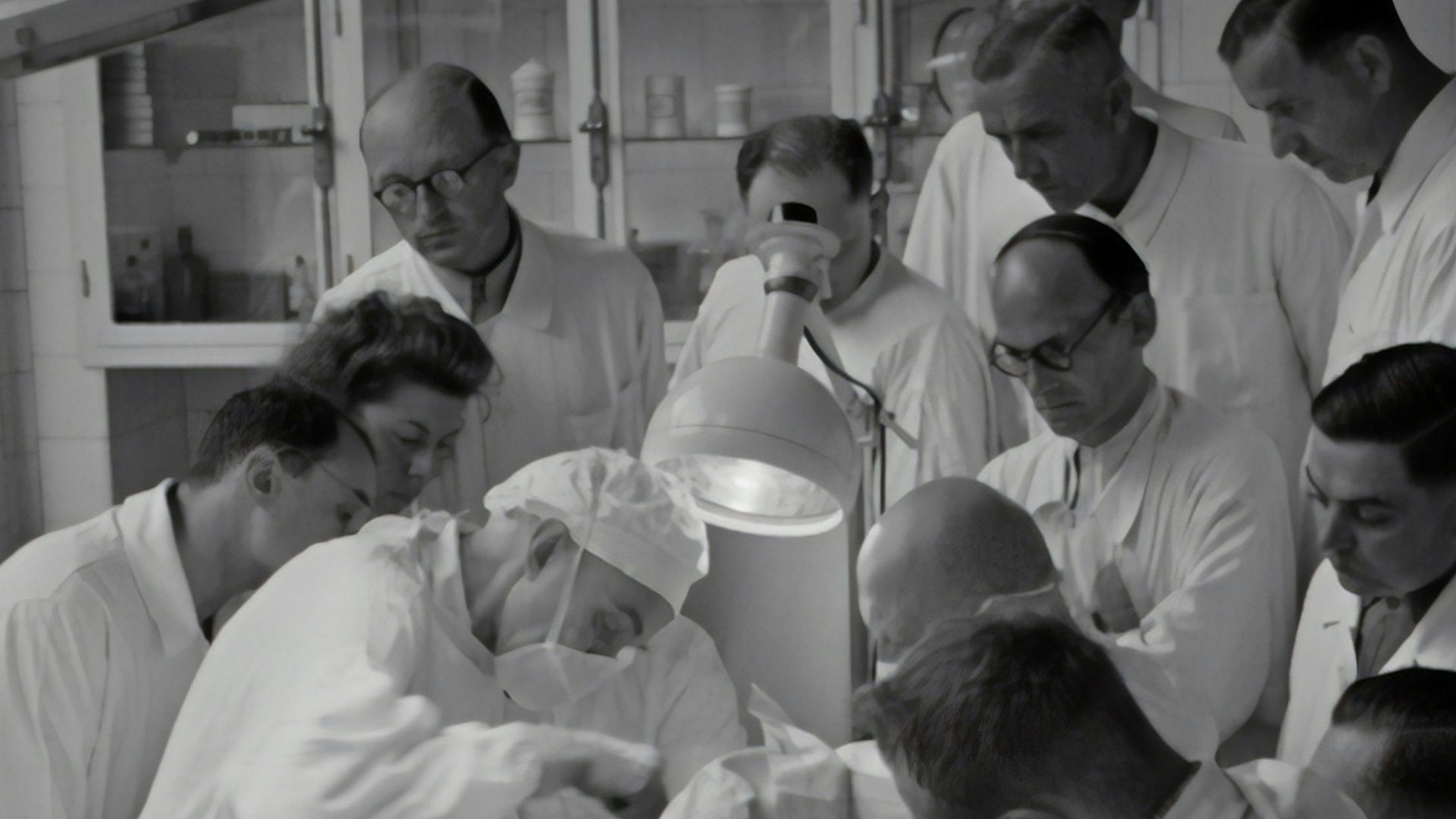 photography of people watching watching operation inside room