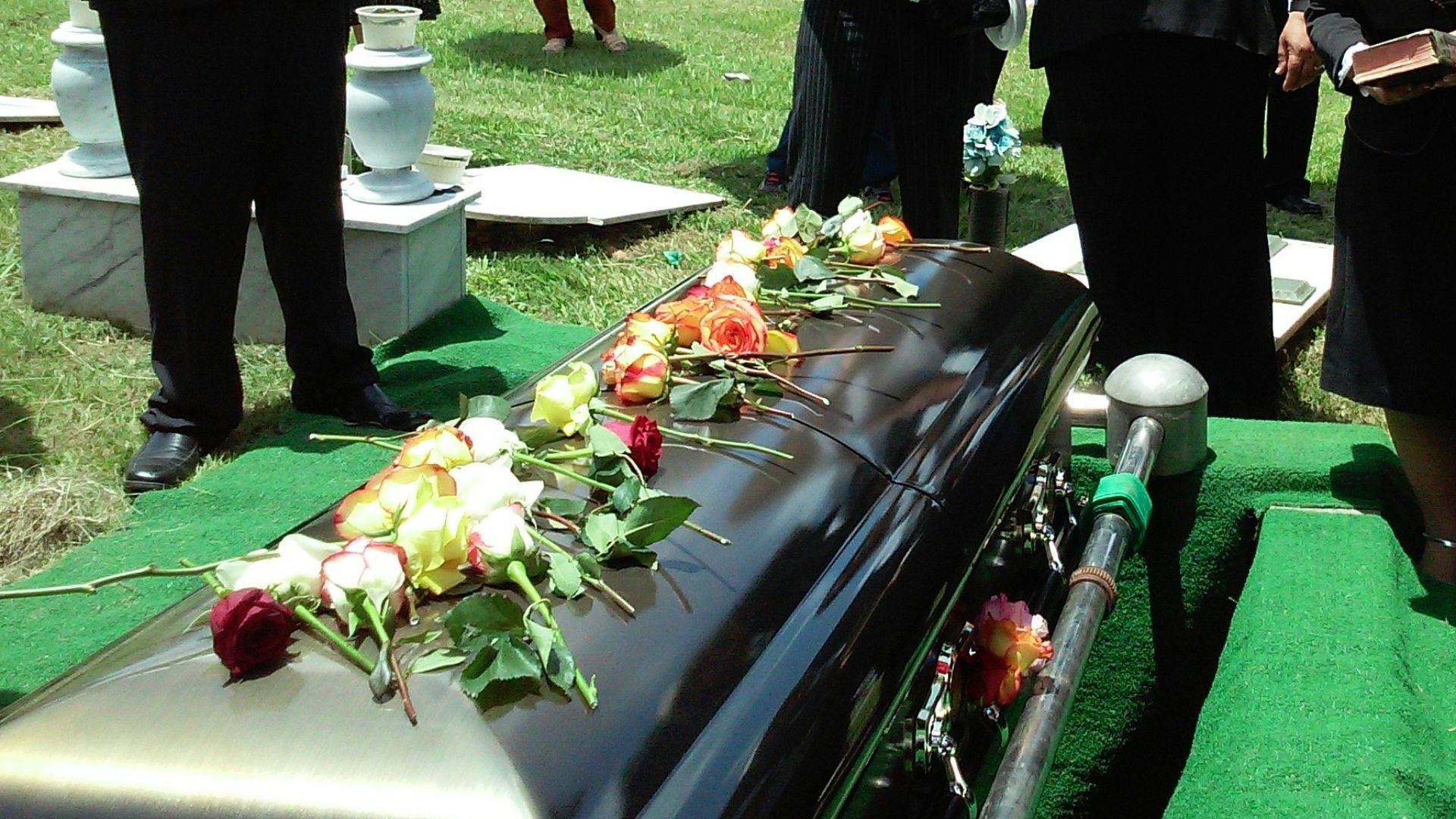group of people attending burial