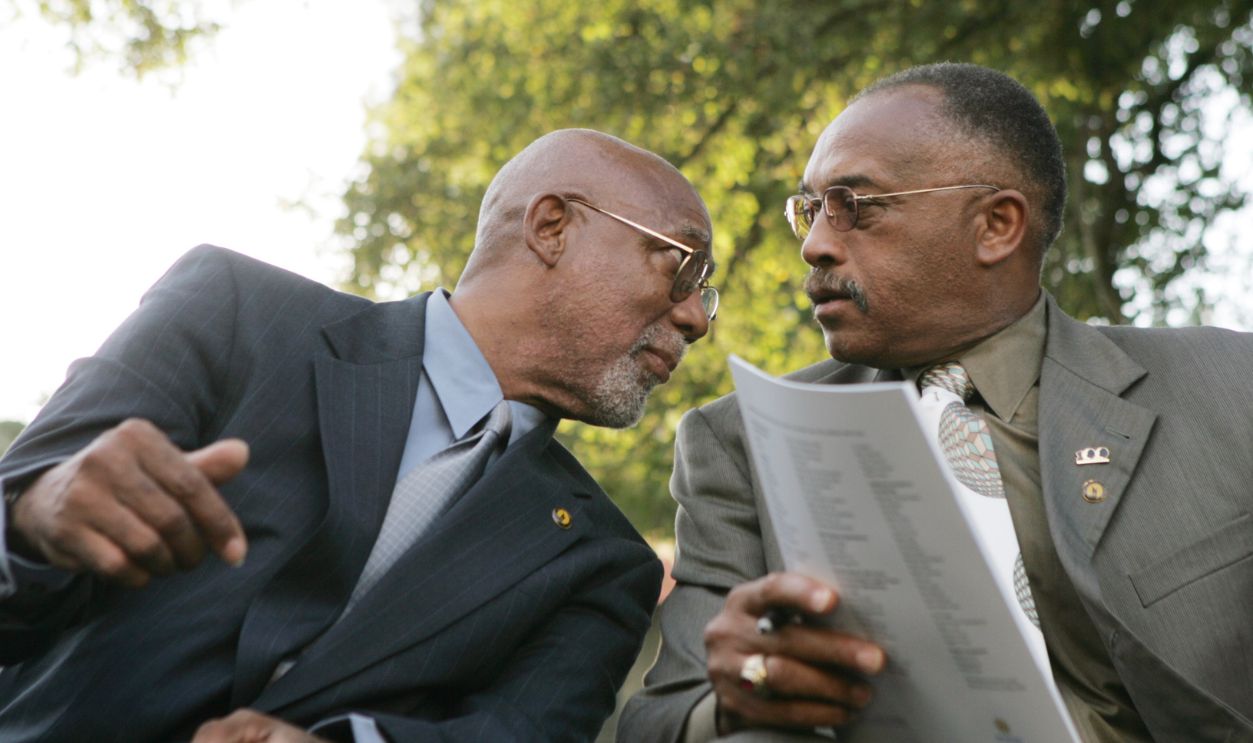 SAN JOSE, CALIFORNIA - OCTOBER 17: John Carlos, left, and Tommie Smith, both San Jose State University alumni, 1968 Olympic medalists, and activists, talk as they wait for the unveiling ceremony to start at San Jose State University in San Jose, California on Monday, October 17, 2005. The University unveiled at statue honoring the protest during the medal ceremony at the 1968 Olympics of San Jose State sprinters Tommie Smith and John Carlos.