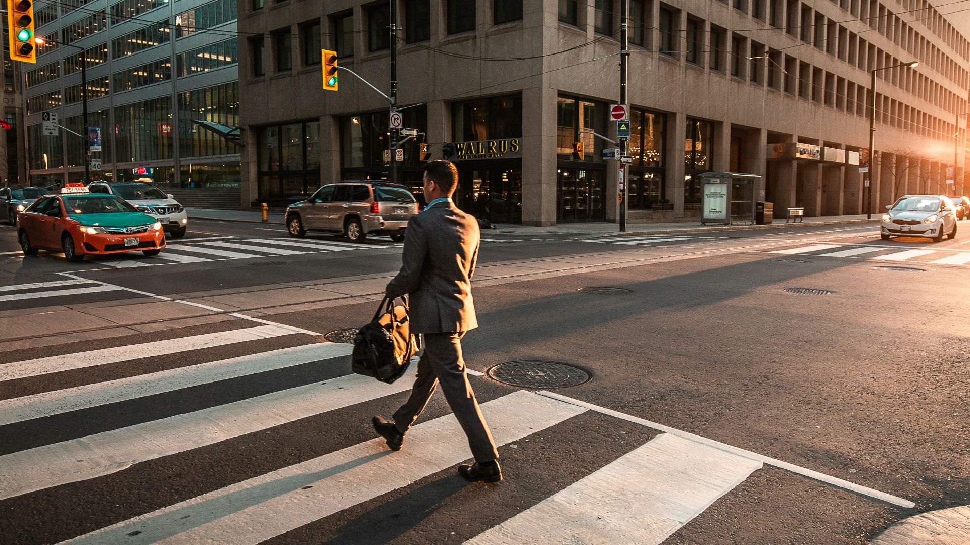 man crossing pedestrian lane