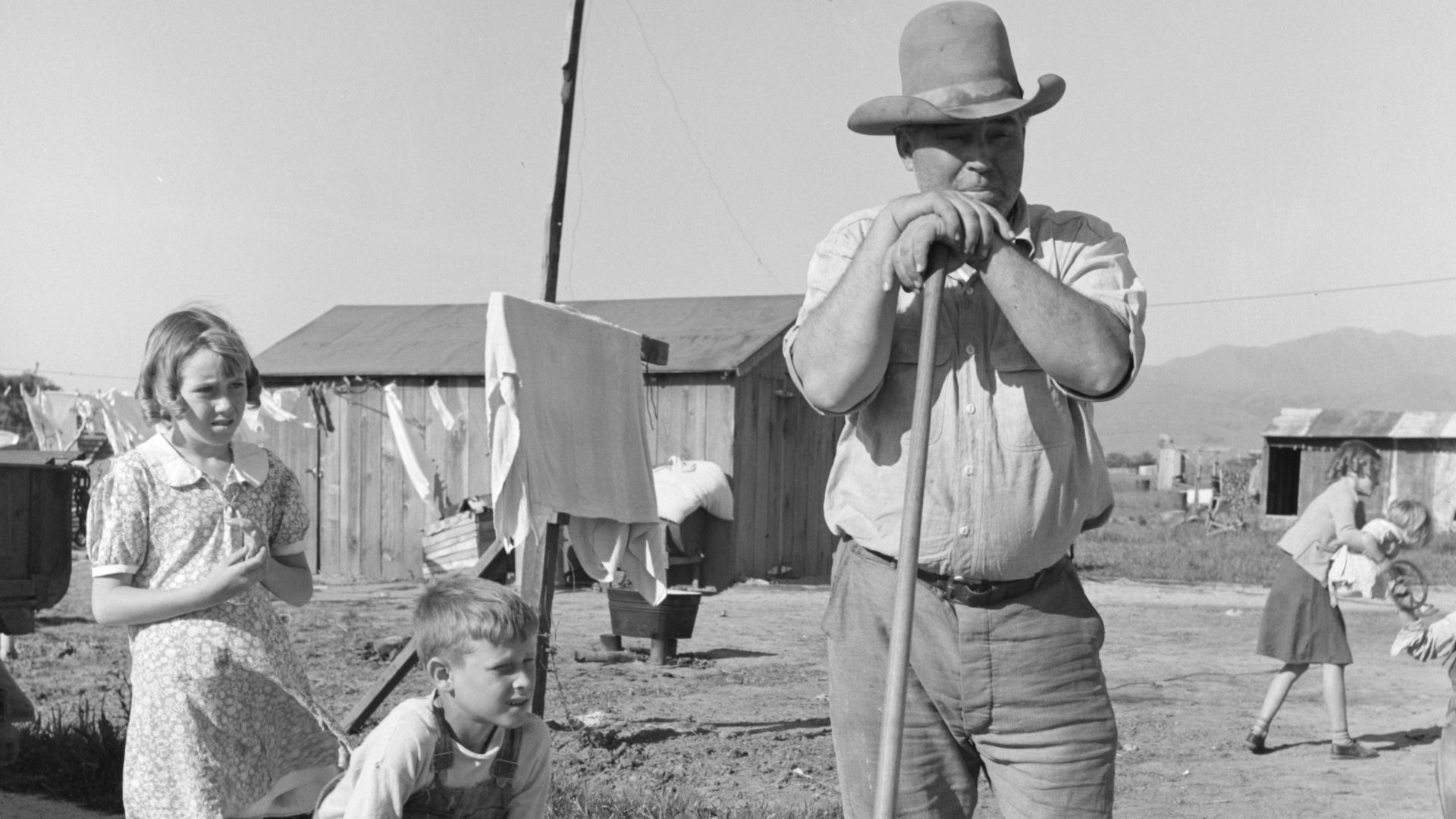 Outskirts of Salinas, California. Rapidly growing settlement of lettuce workers. Family from Oklahoma settling in makeshift dwelling.