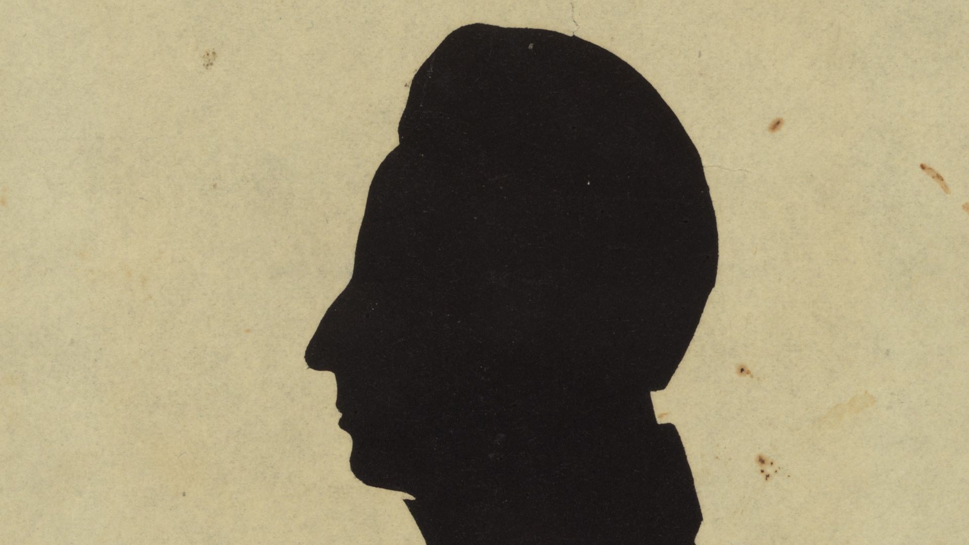 Title: Silhouette of man facing left, no. 1
Abstract/medium: 1 picture : hollow-cut white paper silhouette, mounted on black paper ; irregular image 8 x 4 cm, cut from sheet 13 x 10 cm.