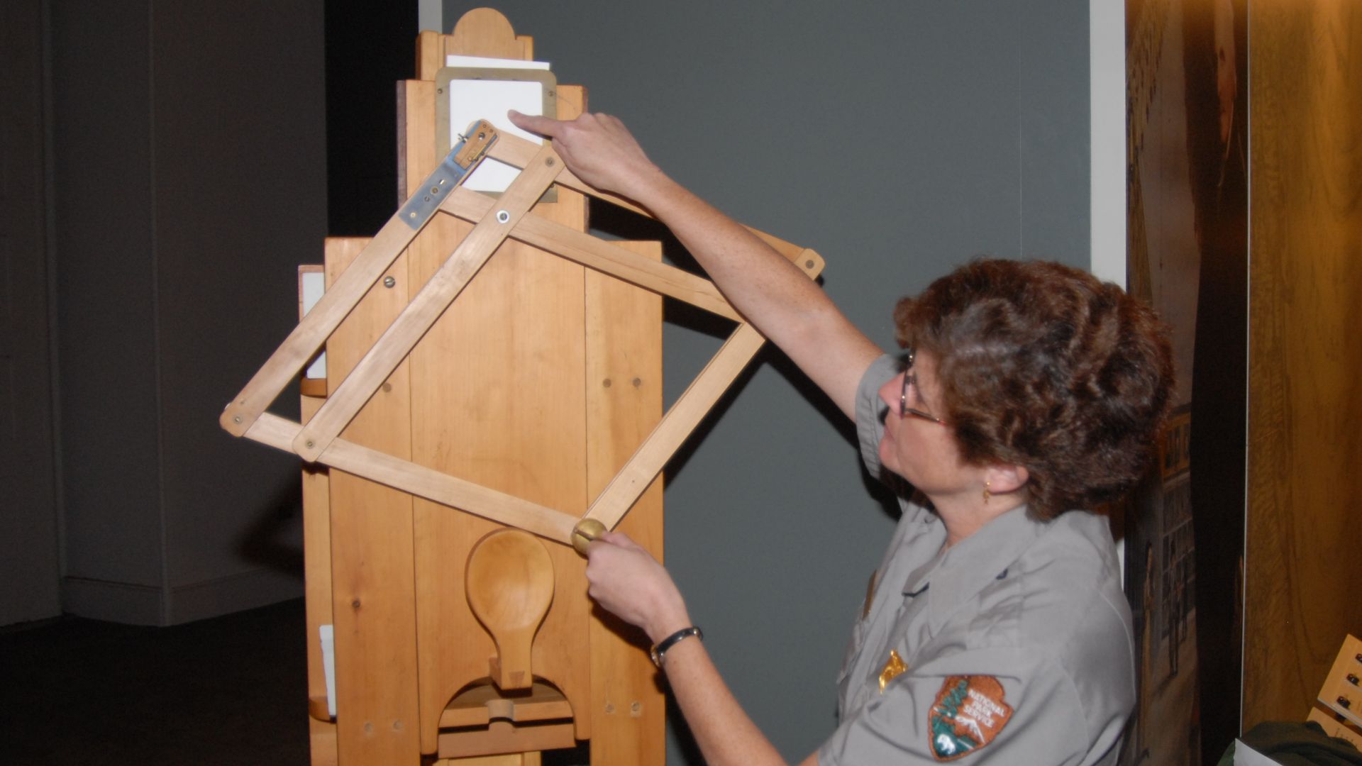 A park ranger points to a white piece of paper while guiding a wooden tracing machine.
Charles Willson Peale had a physiognotrace - or silhouette maker - in his museum in the early 1800s. His enslaved servant, Moses Williams, operated the machine.
Keywor