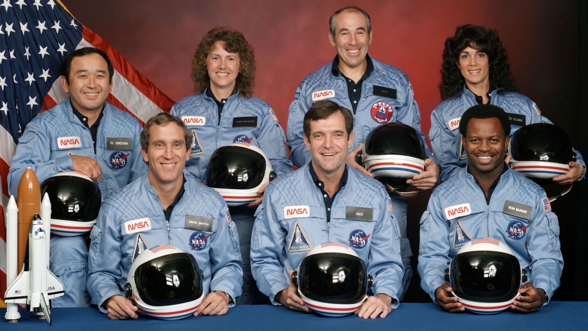 The crew of Space Shuttle mission STS-51-L pose for their official portrait on November 15, 1985. In the back row from left to right: Ellison S. Onizuka, Sharon Christa McAuliffe, Greg Jarvis, and Judy Resnik. In the front row from left to right: Michael