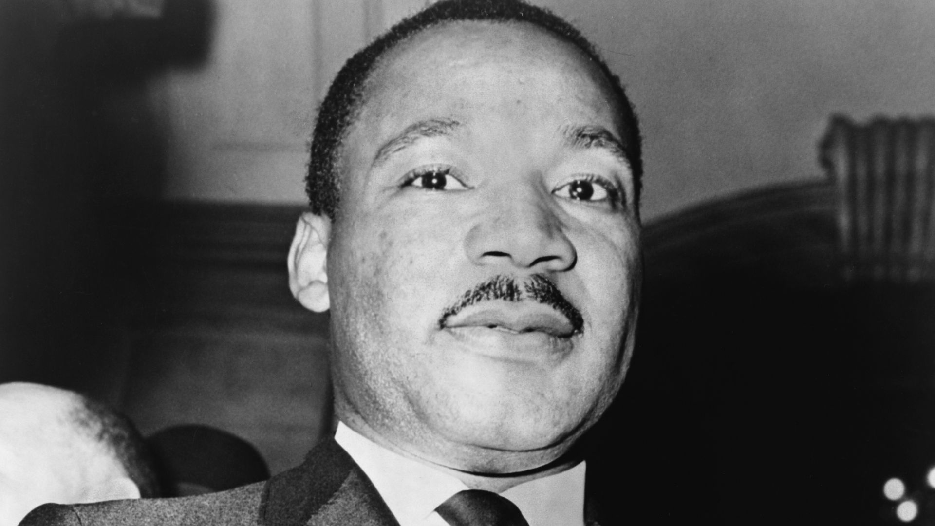 Martin Luther King, Jr. showing his medallion received from Mayor Wagner