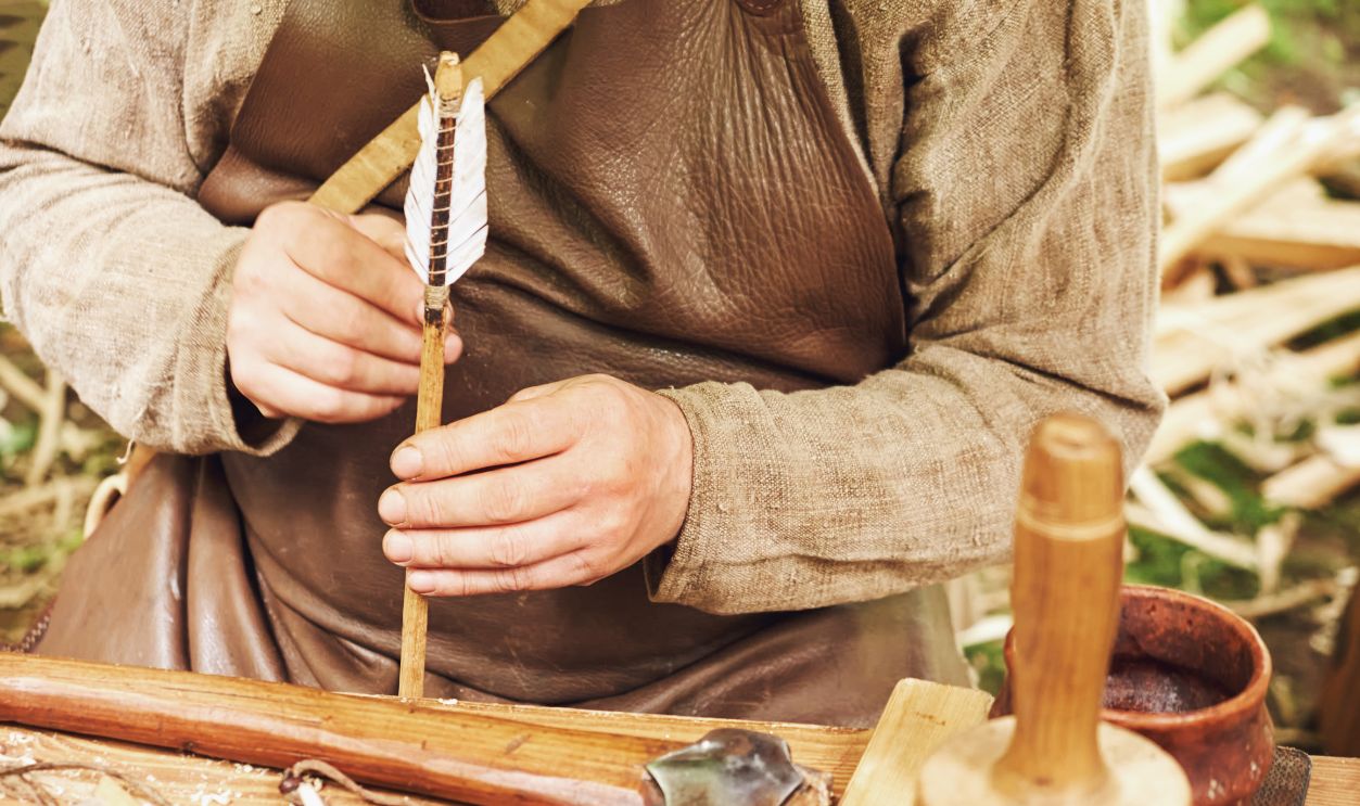 Making medieval arrows for bow shooting. Reconstruction of the events of the Middle Ages in Europe.