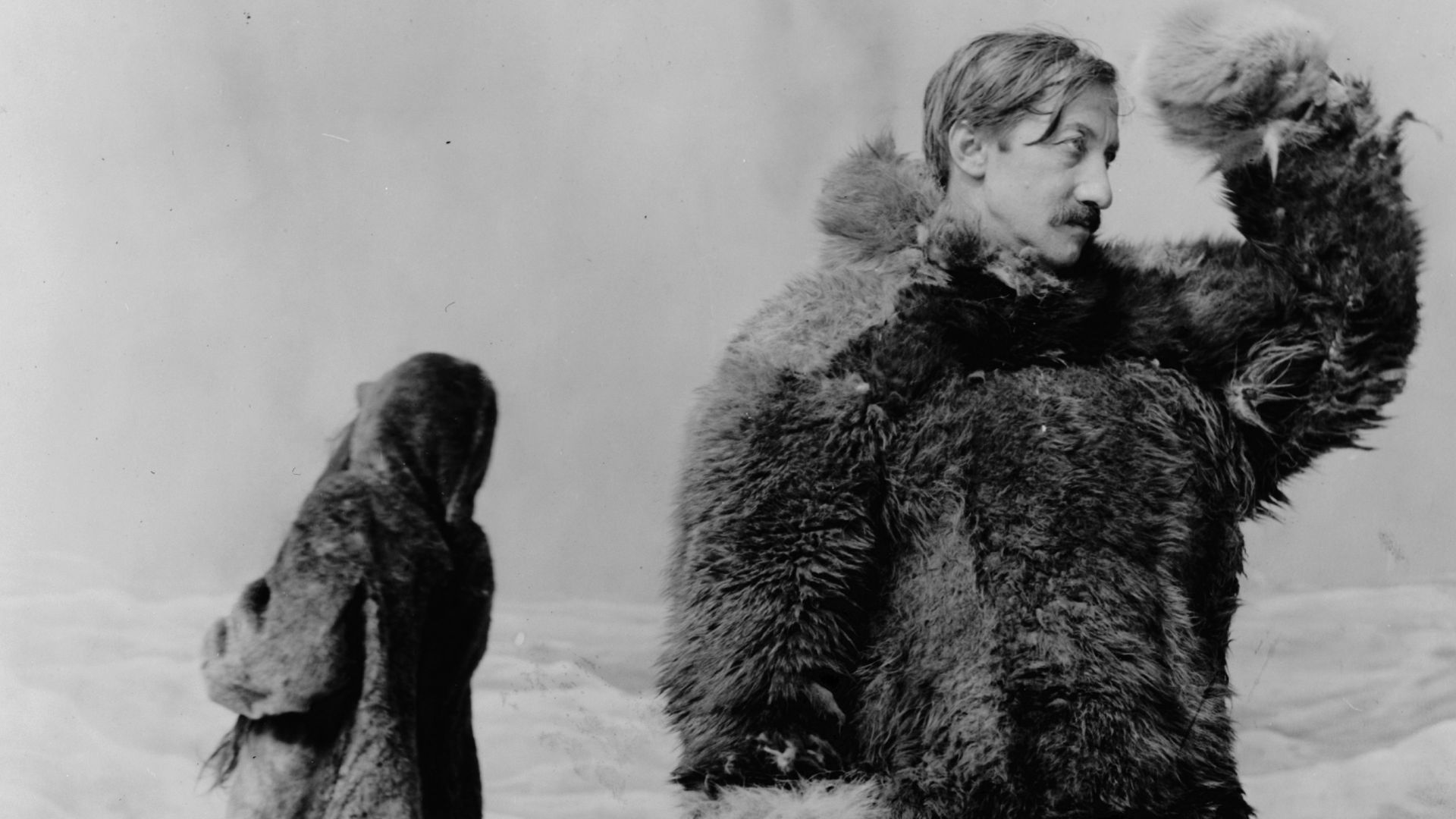 Title: Frederick Albert Cook, full-length portrait, standing, facing right, wearing fur clothing, in front of