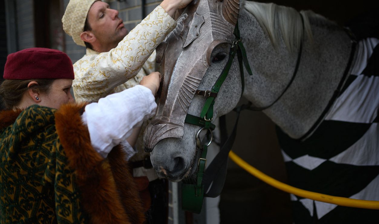 Medieval reenactors prepare a horse in order to take part in the International Jousting Tournament, held at the Royal Armouries Museum in Leeds, northern England, on April 18, 2022. - The four-day tournament, running from April 15 to 18, 2022, has seen knights from Norway, Portugal and the UK battle to be awarded the museum's Sword of Honour and Queen's Jubilee Trophy. The competition is the first time the Royal Armouries Museum has staged a tournament since the Covid-19 pandemic. Points are awarded for: horsemanship, lance skills as well as the accuracy and striking power in the joust. 