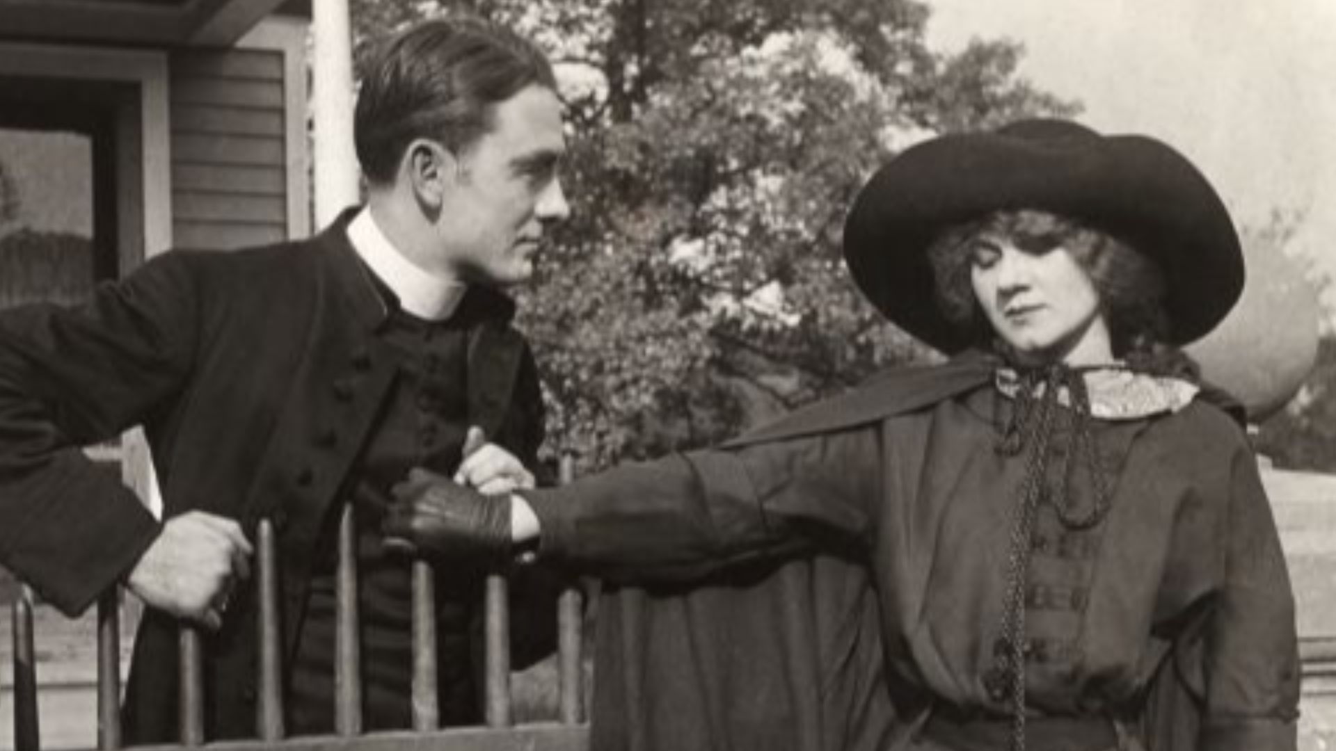 Owen Moore talks to Florence Lawrence in a scene still from a silent drama, possibly The Redemption of Riverton from 1912.