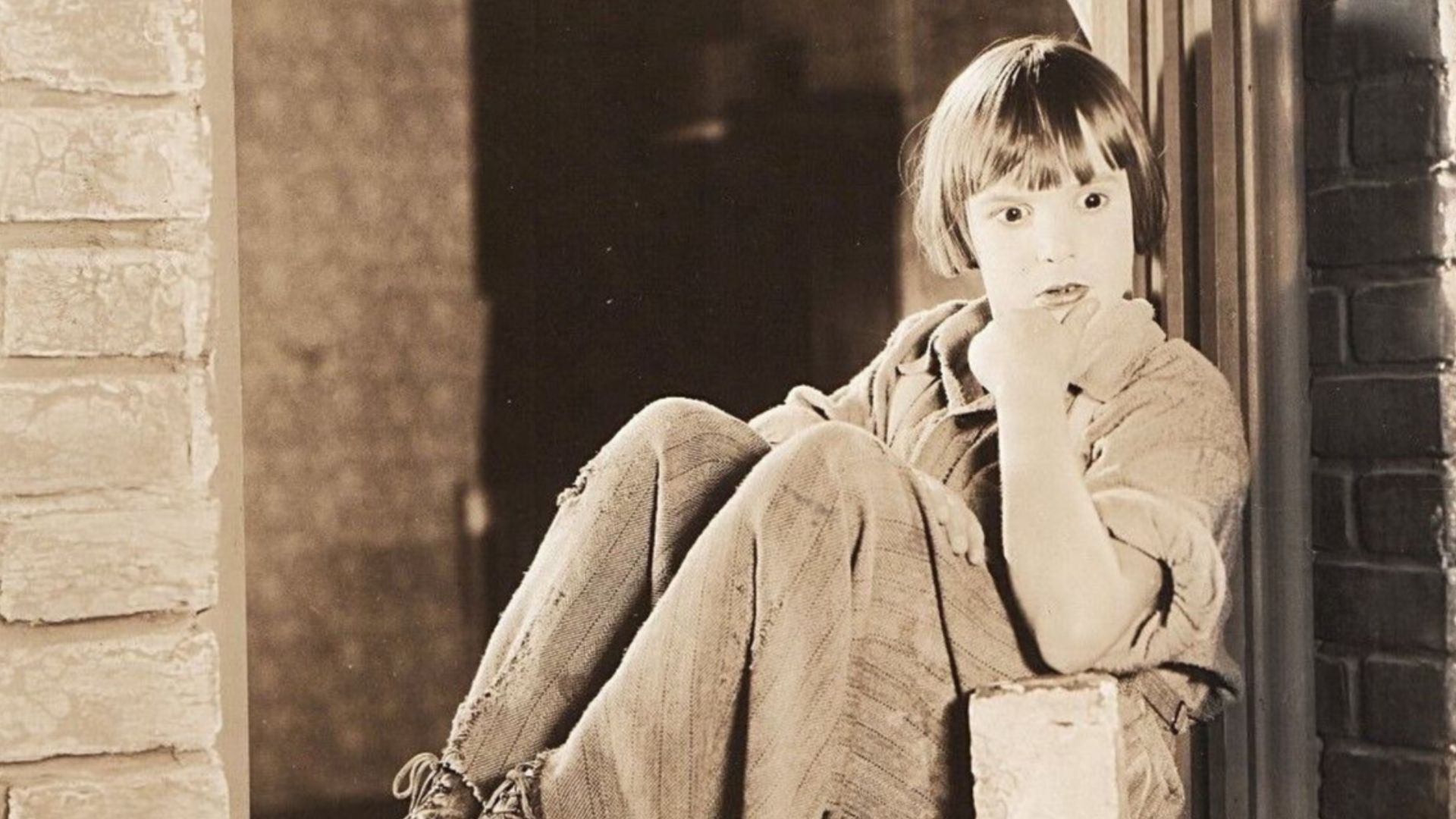 Publicity still of Jackie Coogan in the American drama film Old Clothes (1925).
