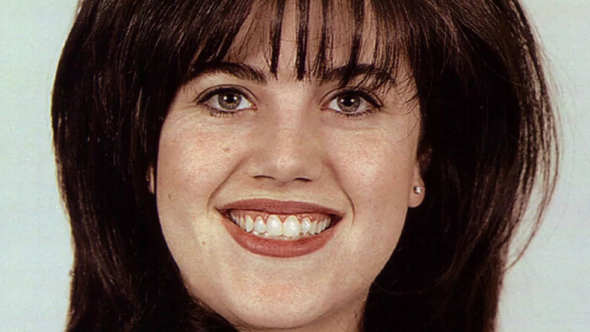 Monica Lewinsky, from her government ID photo by Office of the Secretary of Defense.