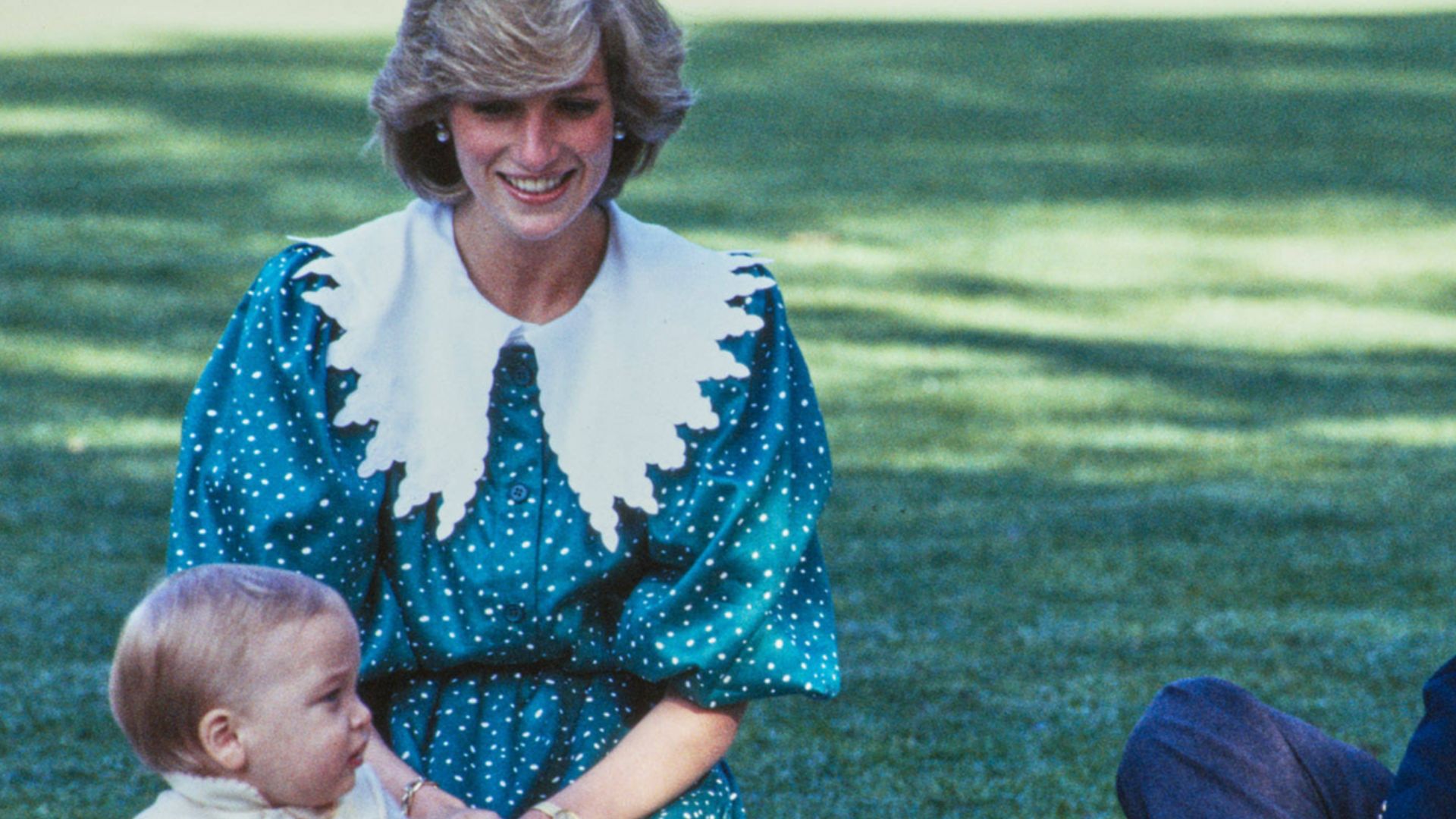 Prince Charles, Princess Diana and Prince William at Government House, with Buzzy Bee. Government House lawns, Auckland, New Zealand. Auckland Libraries Heritage Collections 1423-0465