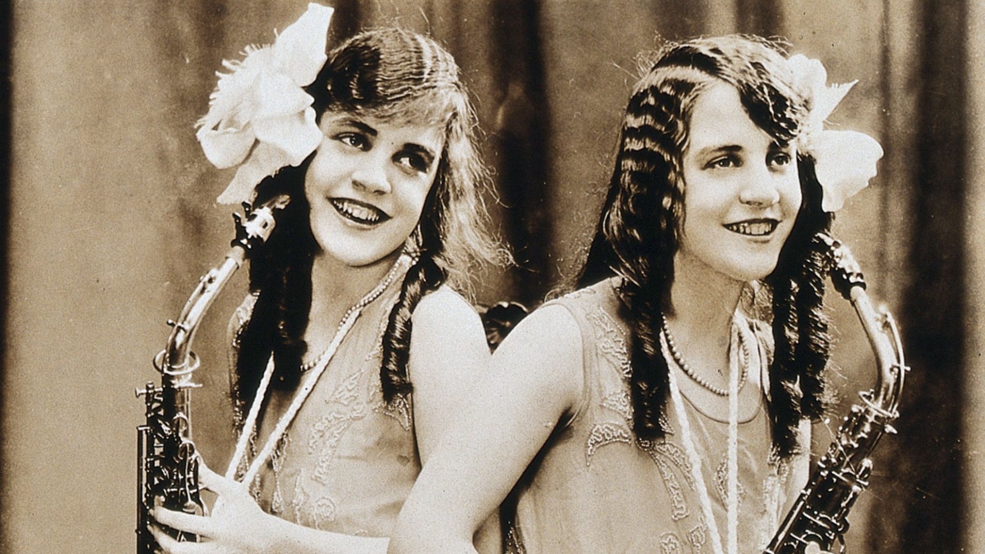 Daisy and Violet Hilton, conjoined twins, with saxophones. Photograph, c. 1927.

Iconographic Collections