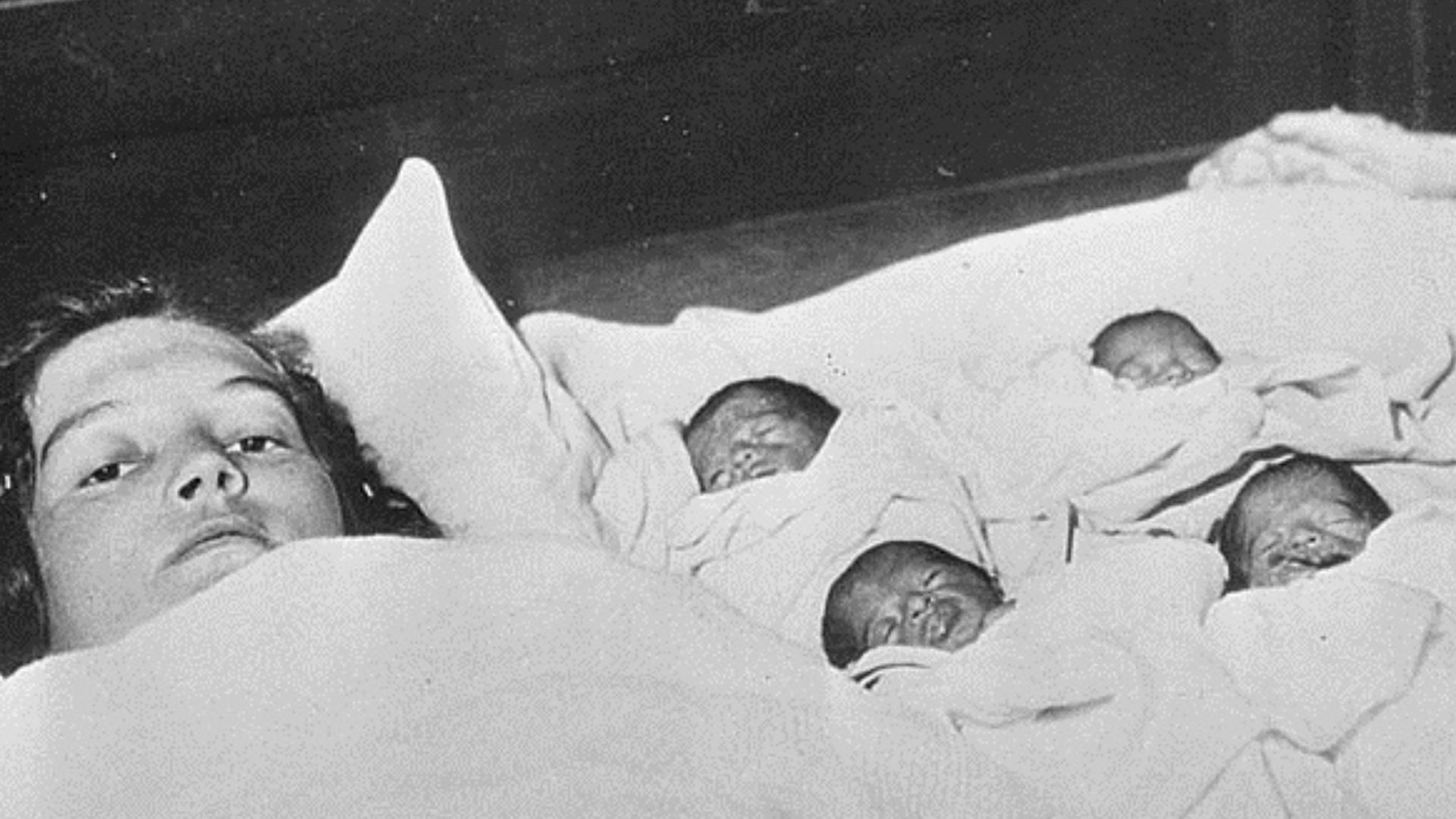 Dionne quintuplets with their mother.
