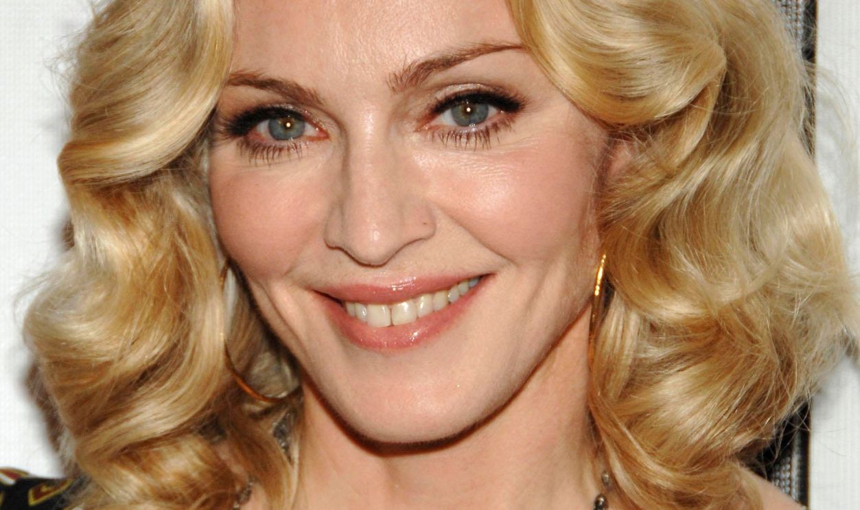 Madonna, wearing a Gucci dress, at I AM BECAUSE WE ARE Premiere, Tribeca Performing Arts Center, BMCC TPAC,, New York, NY, April 24, 2008 Photo by Slaven Vlasic/Everett Collection