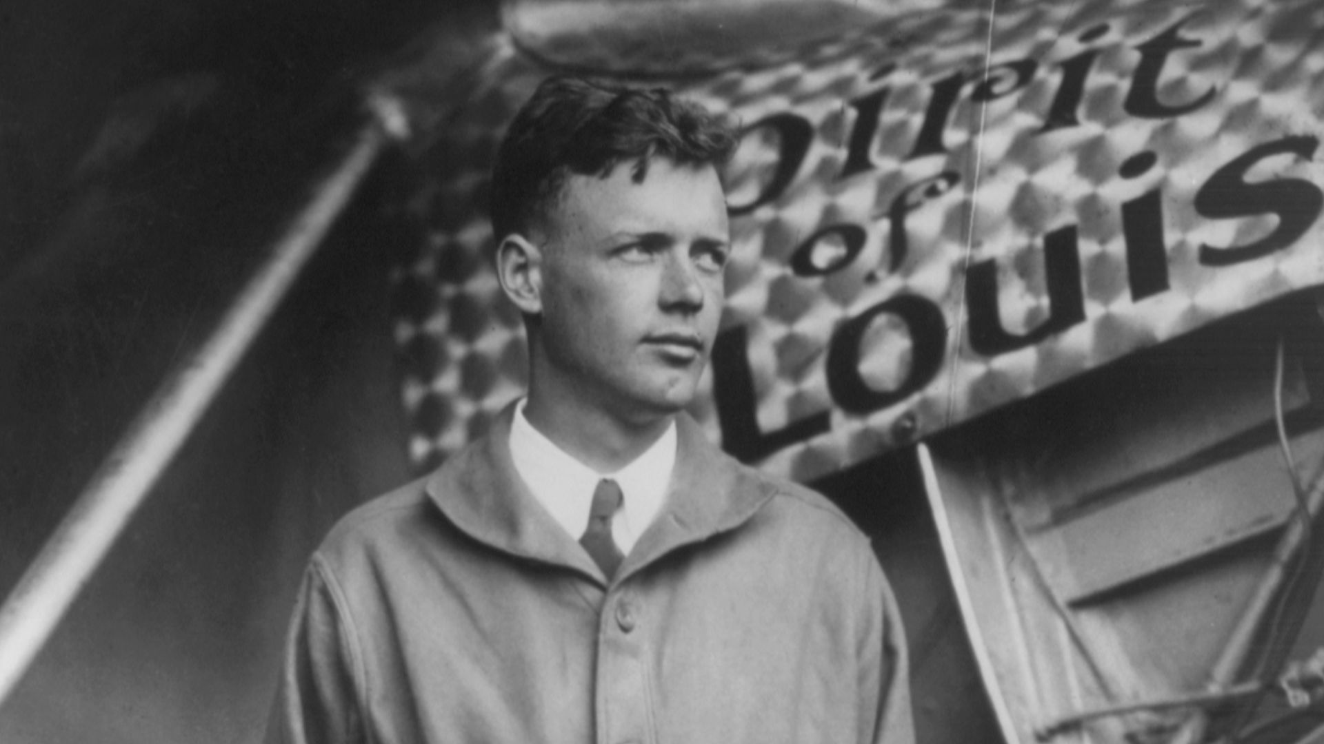 Charles Lindbergh, with Spirit of St. Louis in background. Restored by Crisco 1492 from File:Charles Lindbergh and the Spirit of Saint Louis.tif (removed dust, scratches, including black spots on the wings which may or may not have been there in the origi