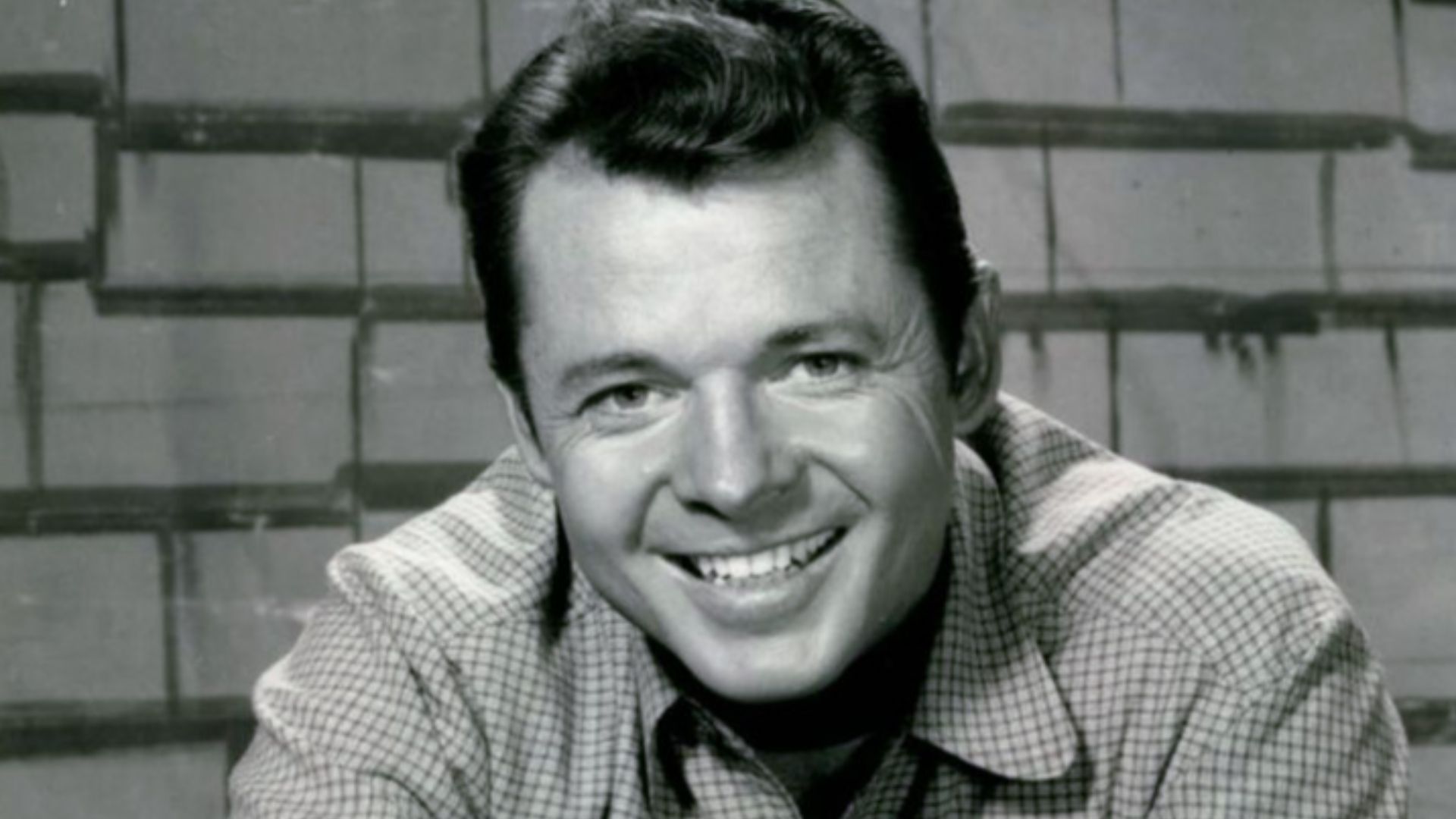 Photo of Audie Murphy as Tom Smith from the television program Whispering Smith.