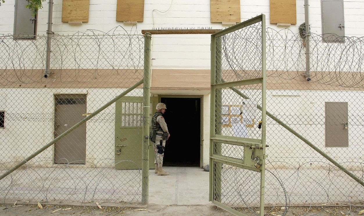 Getty Images - 50821530 - U.S. soldiers maintain security at the Abu Ghraib prison May 10, 2004 in Abu Ghraib, Iraq. Allegations of abuse at the prison, notorious under the Saddam Hussein regime as a place of torture, lead to the suspension of the commanding officer Brigadier General Janis Karpinski and some 17 other soldiers.