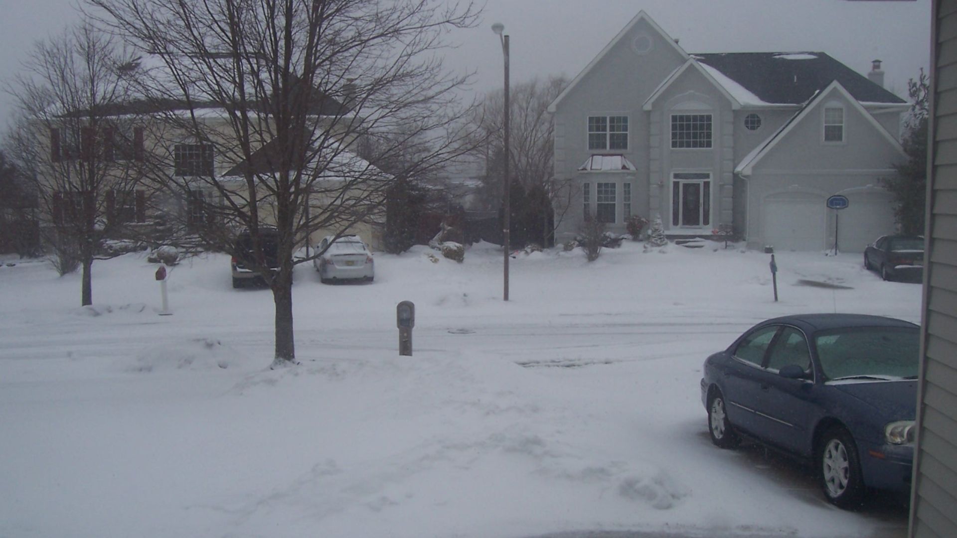 A South Jersey neighborhood blanketed with snow from the first, second an third North American Blizzard of 2010. The storm taking place in the picture is The Third North American Blizzard of 2010.