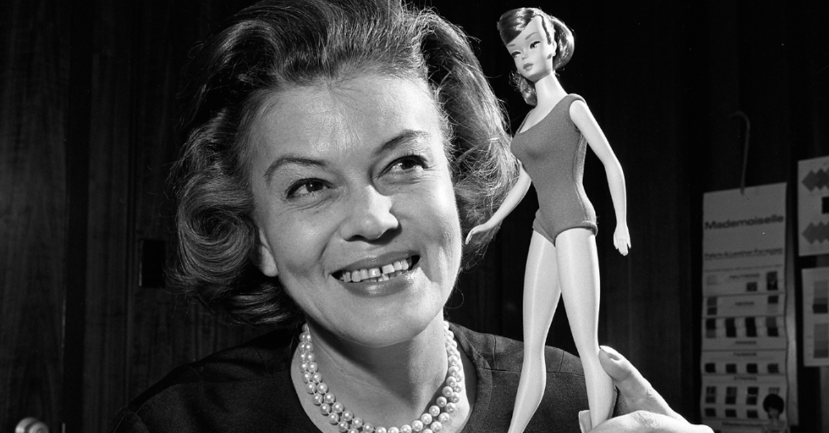 Barbie's first clothing designer Charlotte Johnson posing with 1965 Barbie doll model