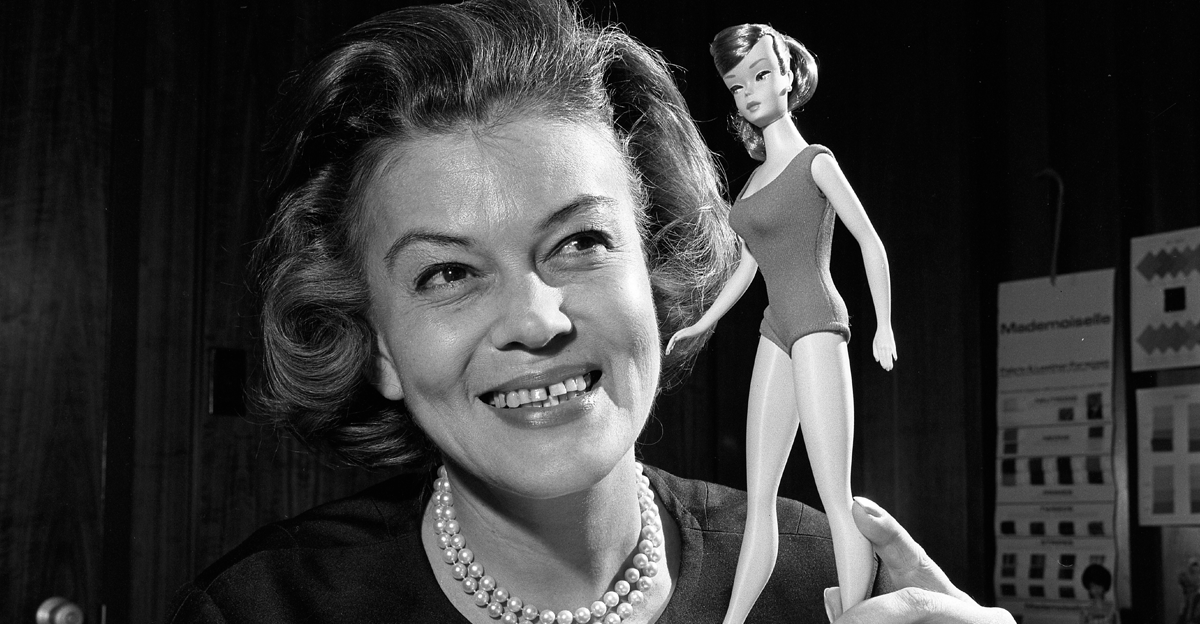 Barbie's first clothing designer Charlotte Johnson posing with 1965 Barbie doll model