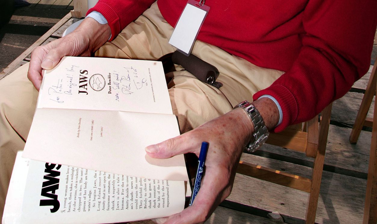 Peter Benchley, author of the novel "Jaws", signs an original copy of the book at a ribbon-cutting ceremony Friday June 3, 2005, launching the start of the first-ever "Jaws" Fest, hosted by the Martha's Vineyard Chamber of Commerce. "Jaws" Fest coincides with the June 14th release of the Jaws 30th Anniversary Edition DVD from Universal Studios Home Entertainment. The DVD includes a special never-before-seen Steven Spielberg interview and a 2 hour documentary on the making of the film.