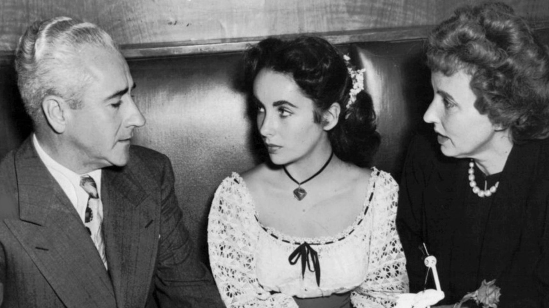 Photo of Elizabeth Taylor with her parents at the Stork Club.