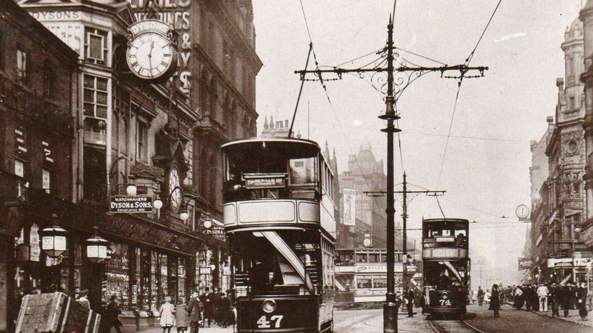 Lower Briggate, Leeds, West Yorkshire, England. Showing the Old Father Time statue by John Wormald Appleyard, on Dyson's clock, on the Time Ball Buildings.