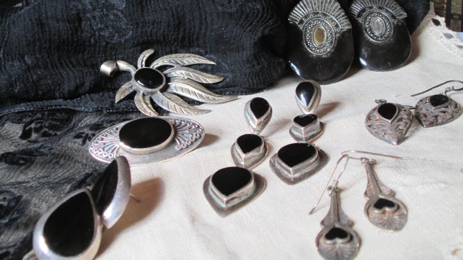 Jet is produced by wood that has been exposed to extreme pressure. It is a form of coal. 
It has been in use since the neolithic period for jewellery and small ornaments. It became particularly popular for use in mourning jewellery during Queen Victoria's