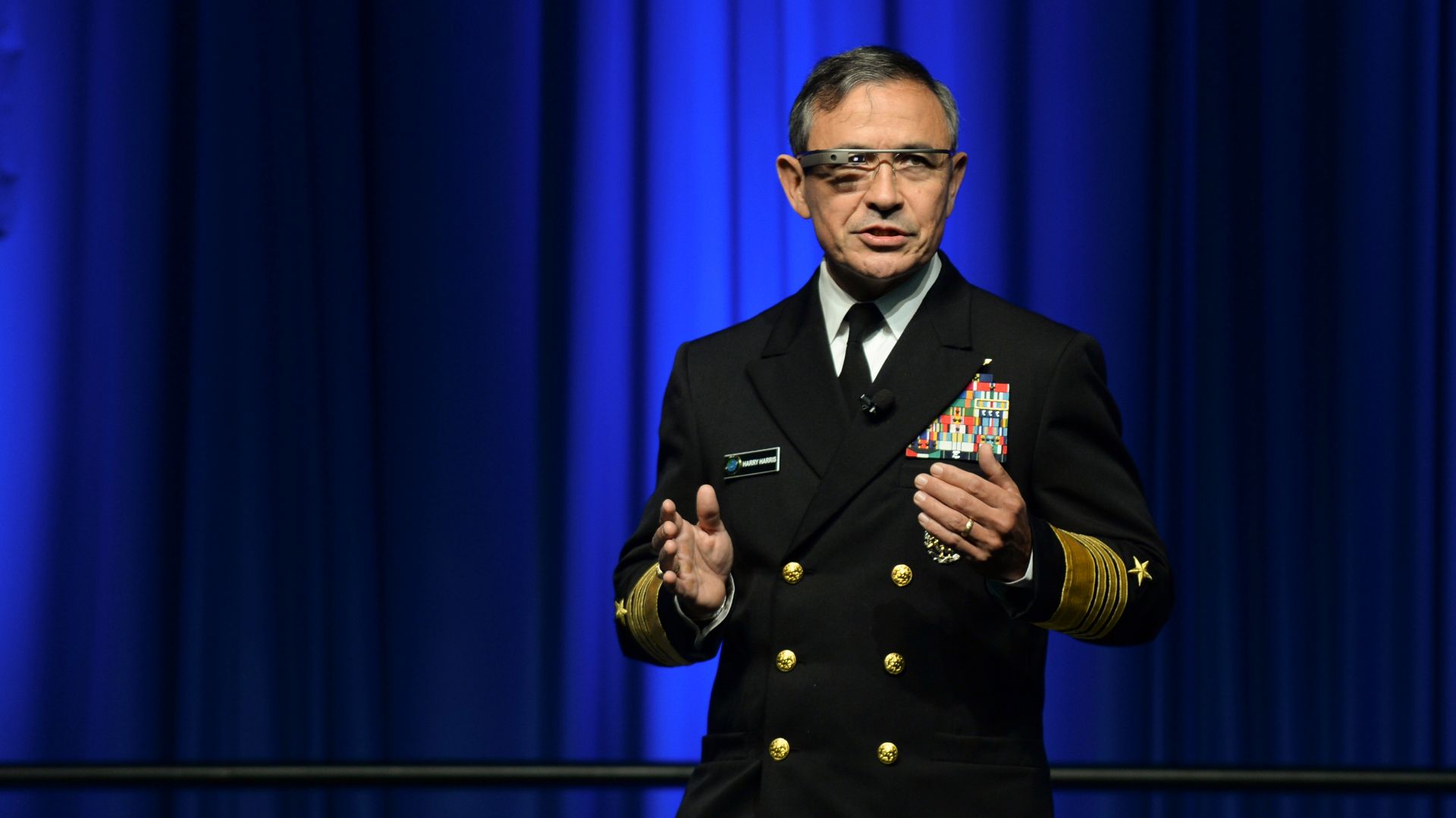 SAN DIEGO (Feb. 11, 2014) Adm. Harry B. Harris Jr., commander of U.S. Pacific Fleet, wears Google Glass while speaking at an Armed Forces Communications and Electronics Association (AFCEA) and U.S. Naval Institute sponsored luncheon where he was featured 