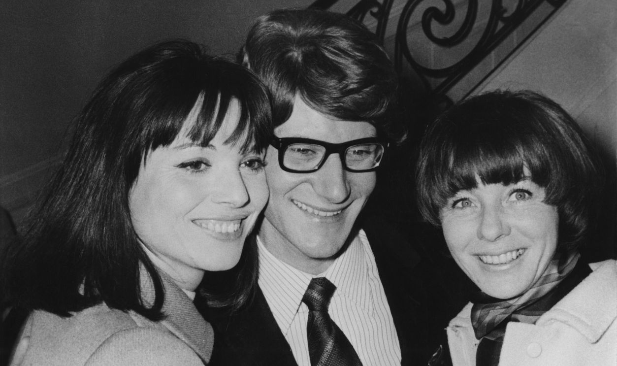 rench fashion designer Yves Saint Laurent (1936 - 2008) with fashion models Elsa Martinelli (left) and Bettina Graziani (right) after his Spring-Summer 1966 fashion show in Paris, France, 4th February 1966.