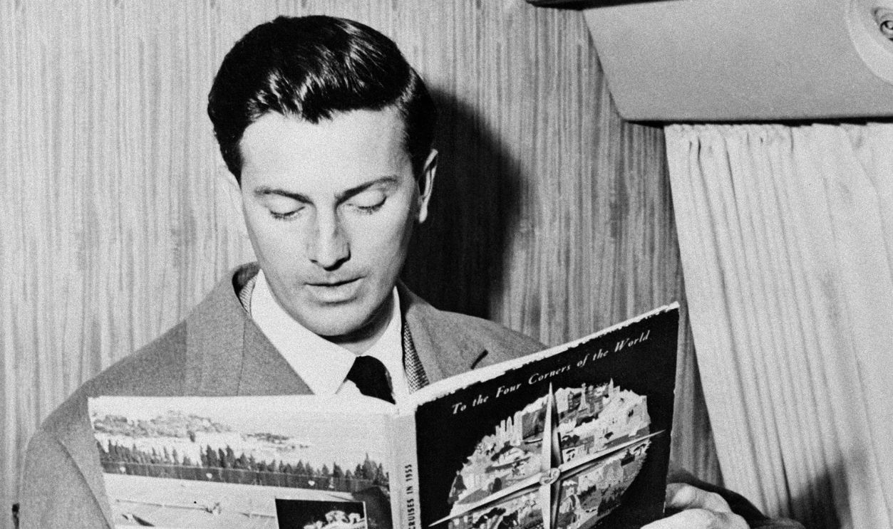 A picture taken 04 July 1957 in a plane shows French designer Hubert de Givenchy. Born in 1927 in Beauvais, France, he studied at the Ecole des Beaux Arts in Paris. His first job in the fashion industry was when he worked for Jacques Fath in Paris in 1945. He then worked for Robert Piguet and Lucien Lelong in 1946, and finally for Elsa Schiaparelli (1947-1951). He opened his own house in 1952. Audrey Hepburn and Jackie Kennedy represented the typical Givenchy style of the 50s and 60s. In 1988, Givenchy sold his business to LVMH but remained head of design until his retirement in 1995.