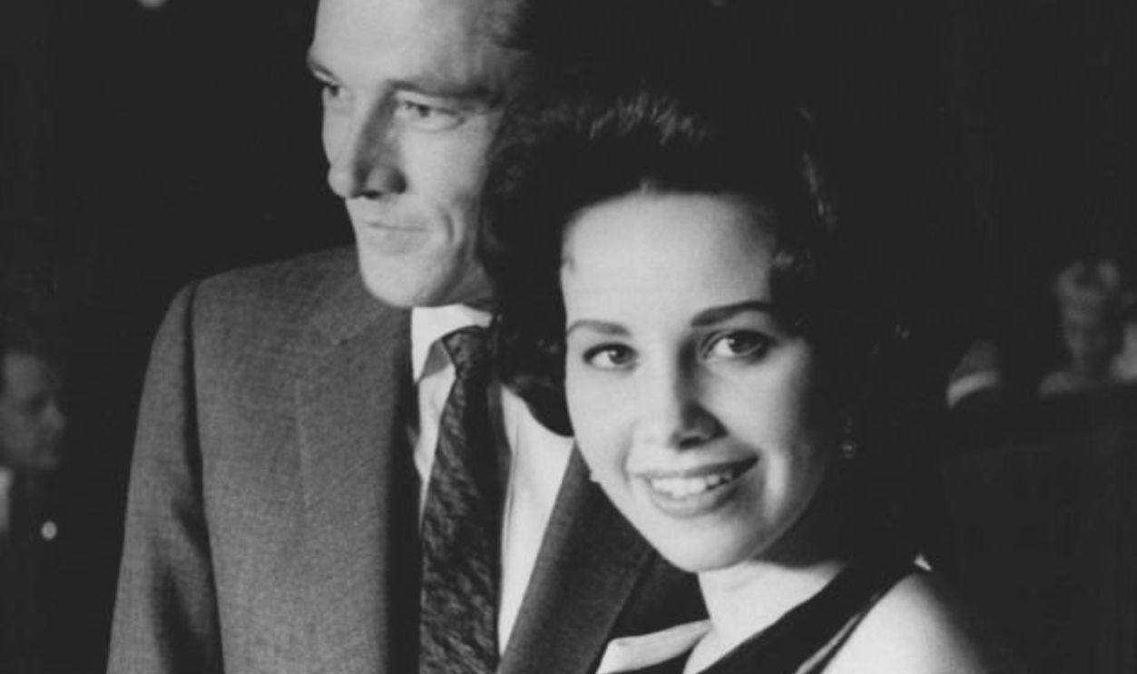 APR 6 1960, APR 7 1960 Two of Hilton's sons were among guess flown in from Hollywood. Shown with his wife, Trish, at cocktail party in new hotel following their arrival is Nicky Hilton, who is a vice president of Hilton Hotels Corp. Credit: Denver Post