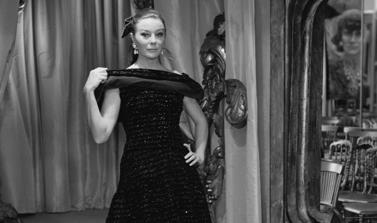 French fashion model Bettina Graziani (1925 - 2015) wearing black long dress by Coco Chanel, France, 31st July 1967.