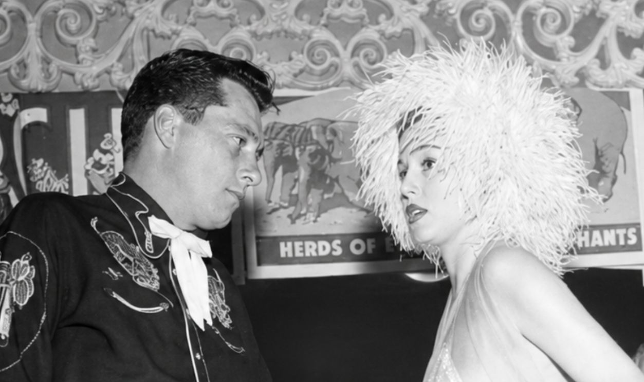 LOS ANGELES - FEBRUARY 5, 1955 : Conrad Hilton, Jr with guest attends Sonja Henie Circus party in Los Angeles, California.