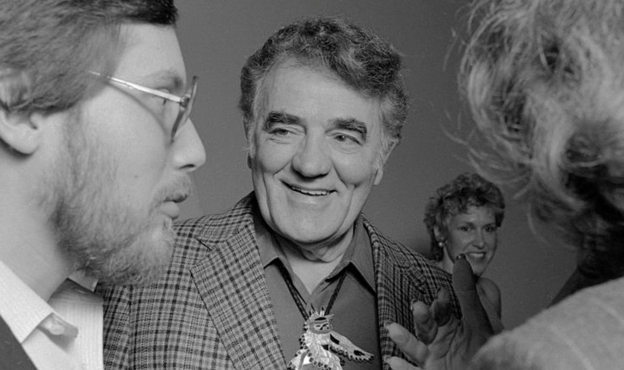Author Louis L'Amour chats with guests at a party hosted by Bantam publicist Judy Hilsinger in Los Angeles.