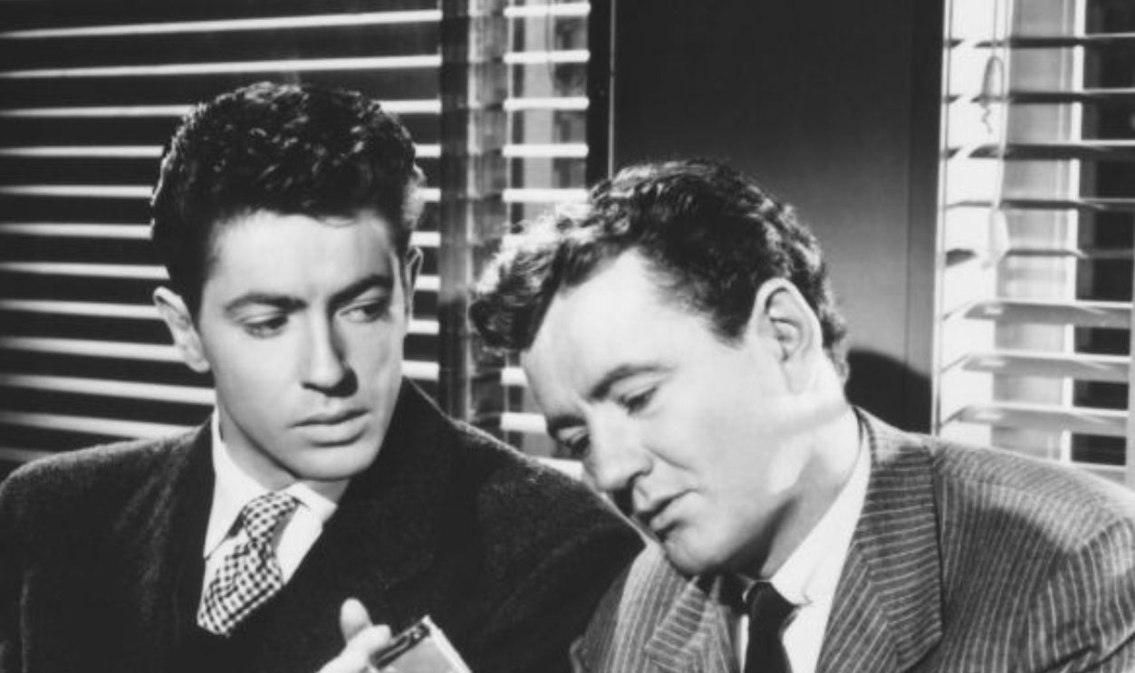 Farley Granger and Robert Walker plan a perfect murder in a scene from Alfred Hitchcock's 1951 thriller 'Strangers on a Train'. 