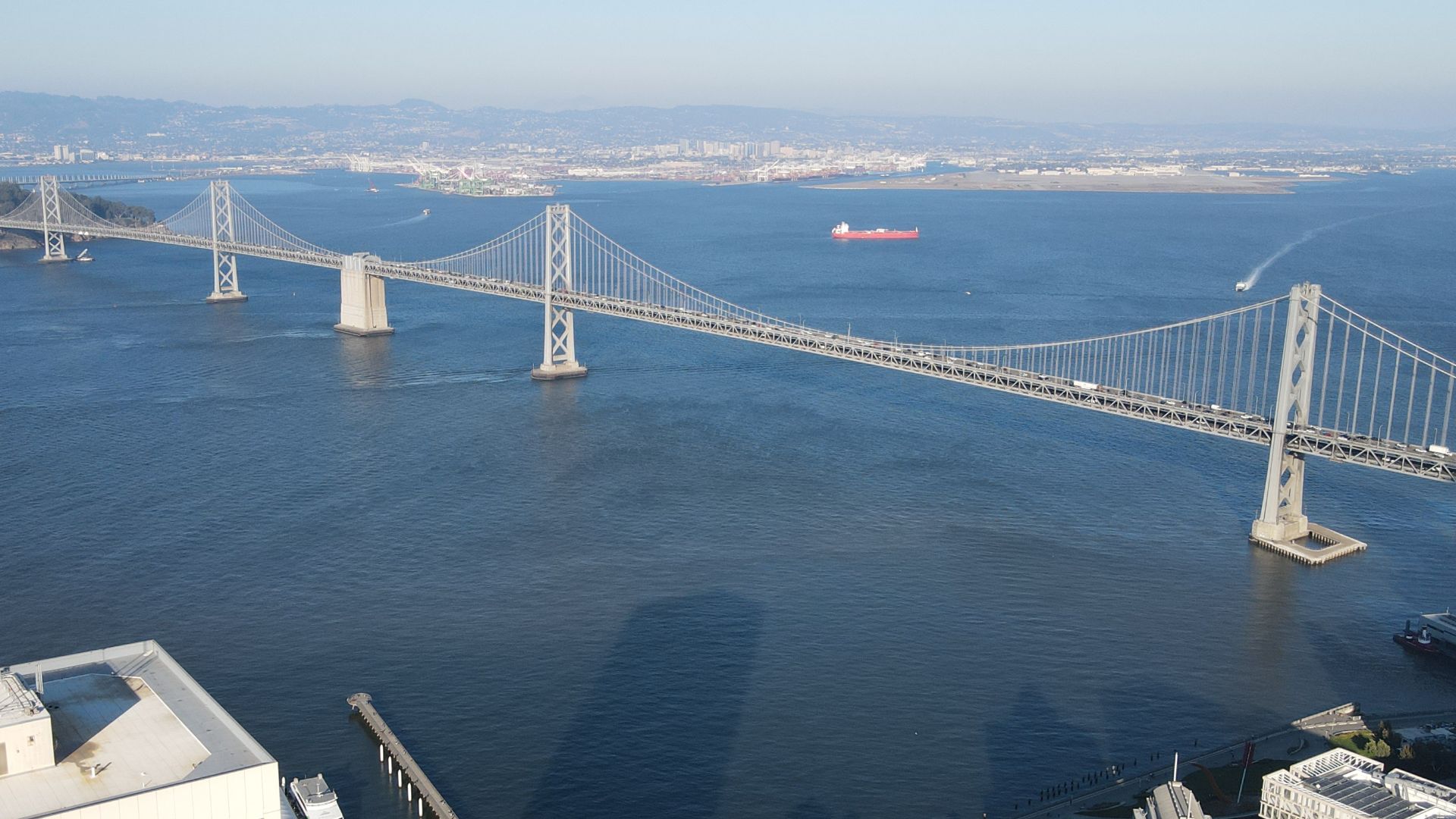 The San Francisco-Oakland Bay Bridge in 2022, as seen from a drone. The western section is prominently seen, though the eastern section is partially visible. Shot on a DJI Mavic Air 2 Drone.