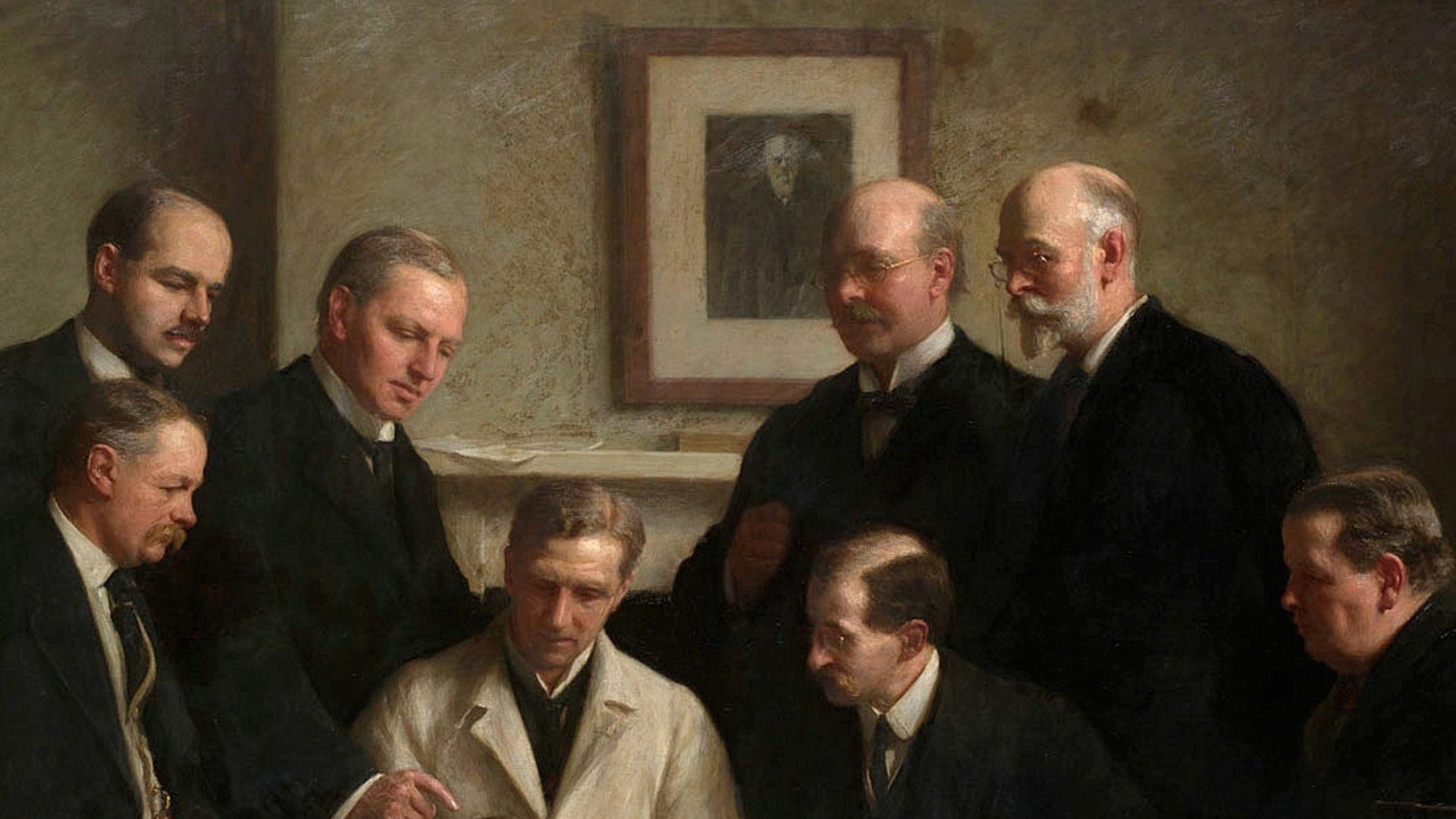 The portrait painted by John Cooke in 1915. Back row: (left to right) F. O. Barlow, G. Elliot Smith, Charles Dawson, Arthur Smith Woodward. Front row: A. S. Underwood, Arthur Keith, W. P. Pycraft, and Sir Ray Lankester. Note the painting of Charles Darwin