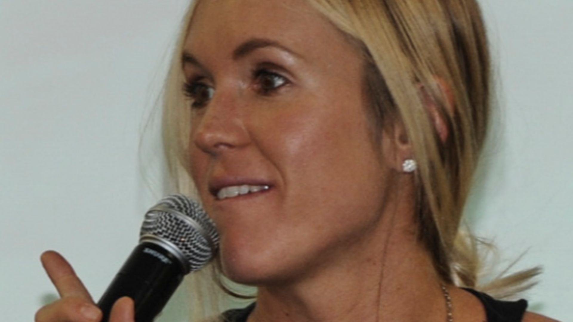 Professional surfer Bethany Hamilton speaks to Airmen and their families at Ellsworth Air Force Base, S.D., March 31, 2016. Hamilton emphasized how her faith was an important part of overcoming new challenges she faced after losing her arm in a shark atta