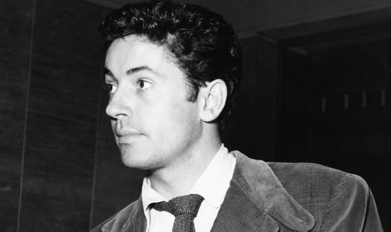 The American actor Farley Granger showing his documents at the airport. Rome, 1950s