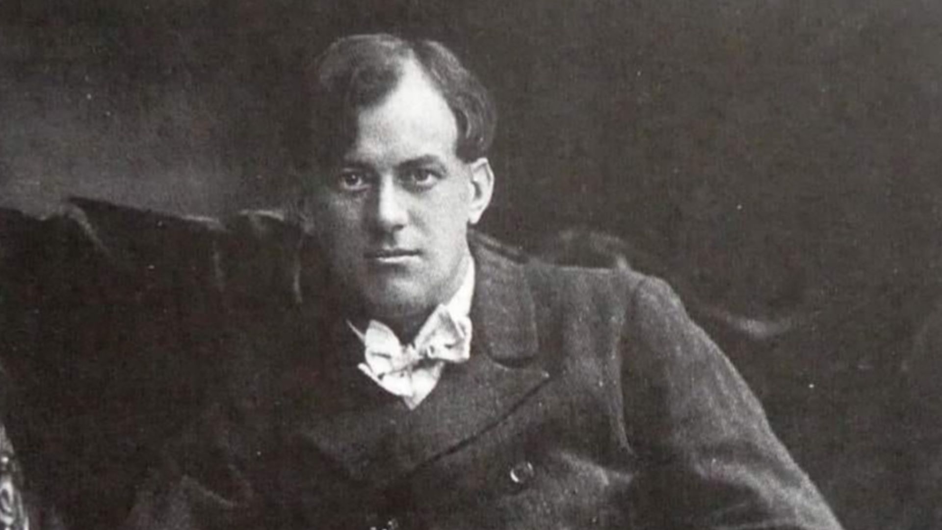 Image is clearly taken during the youth of Aleister Crowley, and as such is extremely unlikely to have been taken any later than 1929 - he was already bald and wrinkled by then.
