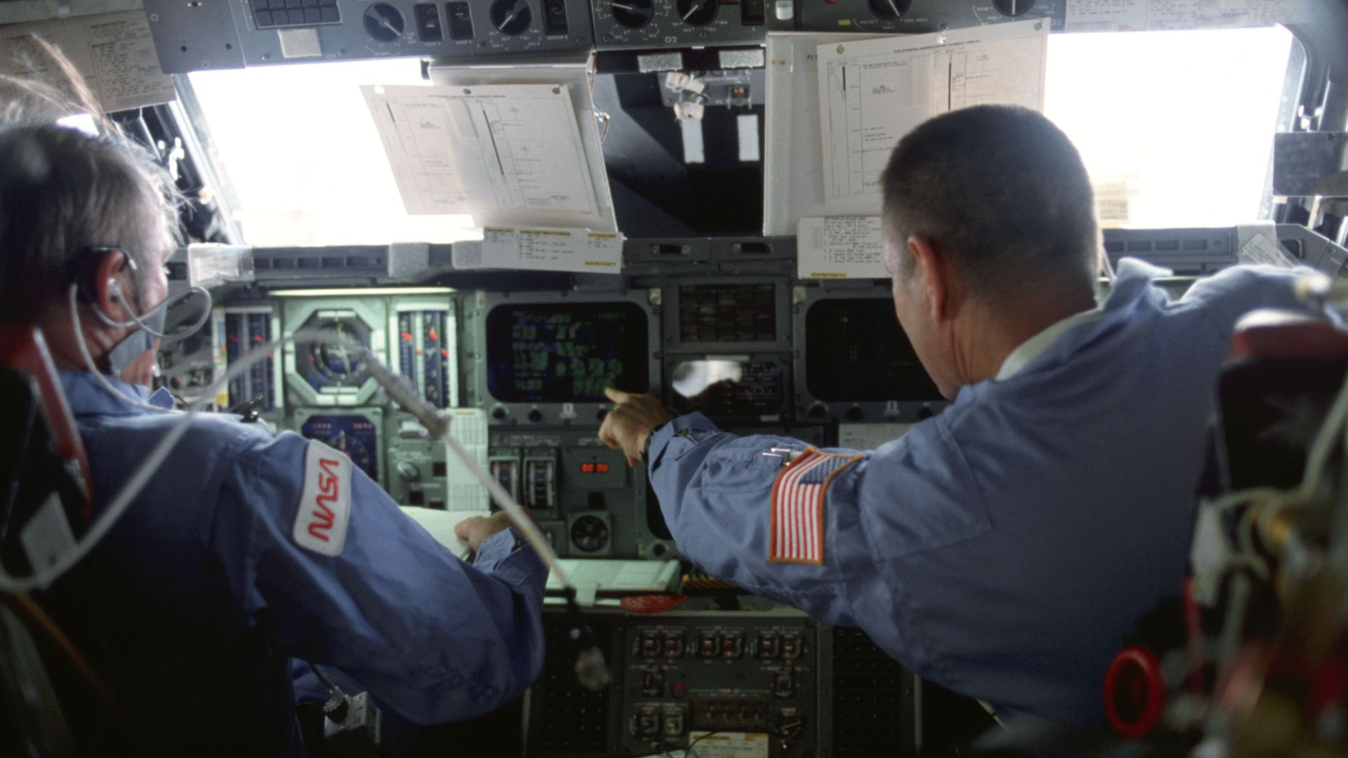 Half of the four-member astronaut crew for the Earth-orbiting space shuttle Columbia's STS-5 mission is pictured on the flight deck of the reusable vehicle. Astronaut Vance D. Brand, commander, holds down the commander's station at left, while astronaut R