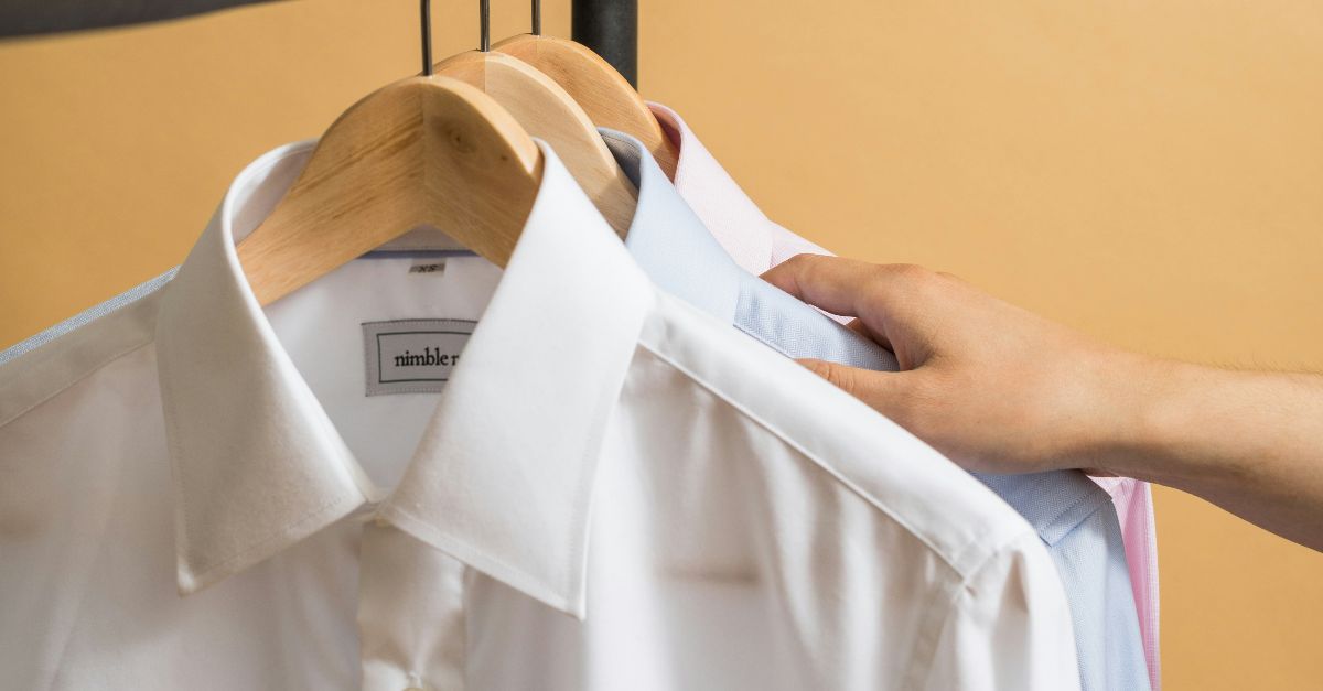 white button up shirt on clothes hanger