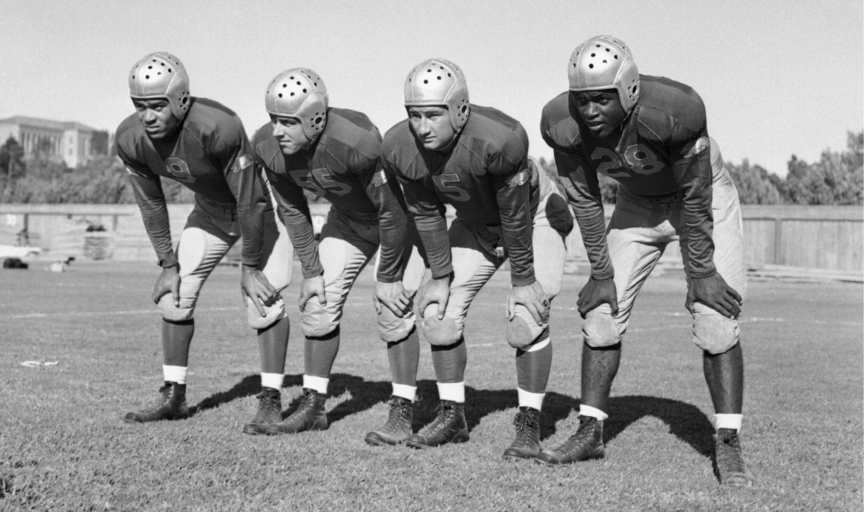The 1st string backfield of the UCLA football team, left to right: Ray Bartlett, right halfback; Ned Matthews, quarterback; Bill Overlin, fullback; Jackie Robinson, left halfback.